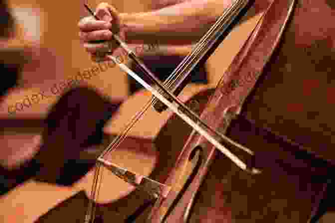 A Close Up Of A Cello Being Played In A Dimly Lit Concert Hall, The Bow Gliding Across The Strings, Creating A Resonant And Soulful Sound. Sacred Melodies For Solo Cello