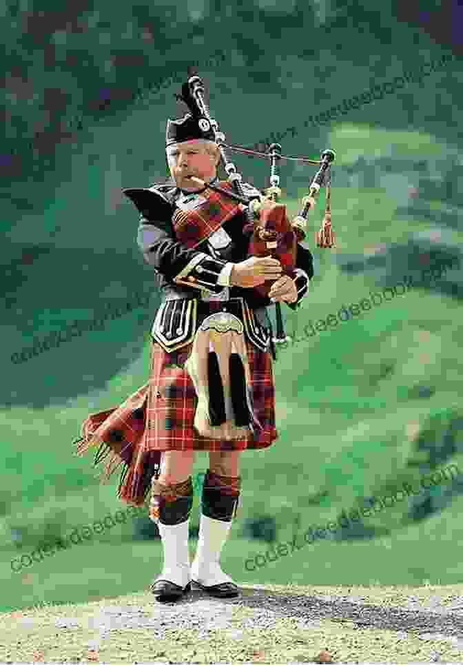 A Scottish Piper Playing The Bagpipes, A Traditional Musical Instrument, While Wearing A Kilt, A Symbol Of Scottish Heritage. Scotland: Where To See (Must See Scotland)