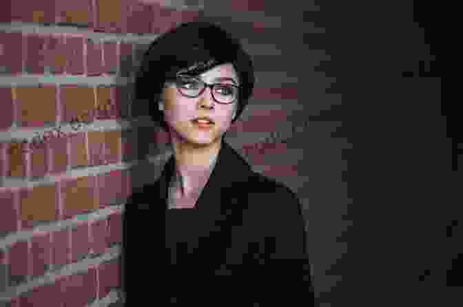 Alona Gaines, A Woman With Short Brown Hair And Glasses, Smiles While Looking At A Robot. Robogirls Alona Gaines